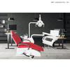 Стоматологическое кресло красного цвета с большим обзором и креслом с системой внутренней связи